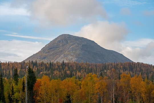 Majestic Mount Iremel Summit Rising Above Golden Autumn Taiga Forest