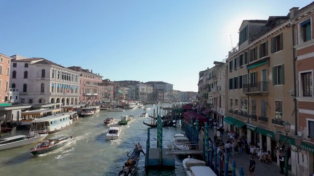 Historic urban canal lined with colorful buildings busy water