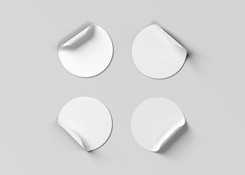 Blank curled stickers collection isolated on grey. Circular labels mockup. 3D rendering