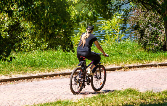 Cyclist ride on the bike path in the city Park
