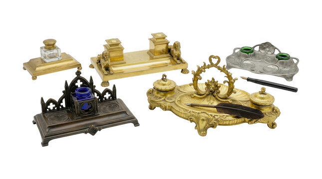 Collection of antique vintage inkwells and writing sets made of brass, bronze, and pewter isolated on transparent background
