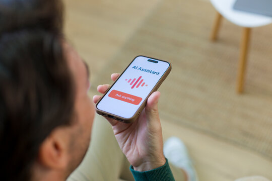 White person using ai assistant app on smartphone at home