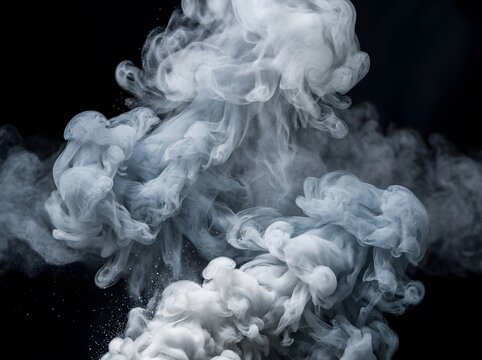 White smoke clouds swirling against a solid black background