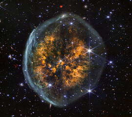 Vibrant glowing "Exposed Cranium" nebula in deep space captured by telescope (Elements of this image furnished by NASA) © TenWit