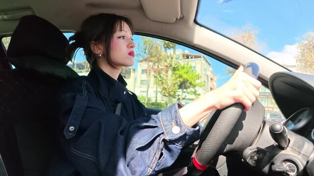 Frustrated Woman Driving Car Looking Annoyed Behind Steering Wheel, Angry Female Driver Experiencing Road Rage Traffic Stress Footage, Transportation and Emotion Concept Video, Stressed Driving Scene