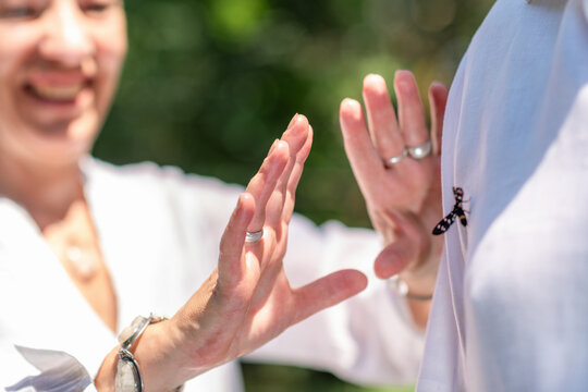 Open hands near the chest during a spiritual chakra healing session, symbolizing energy flow, emotional balance, mindful connection, and holistic wellbeing.