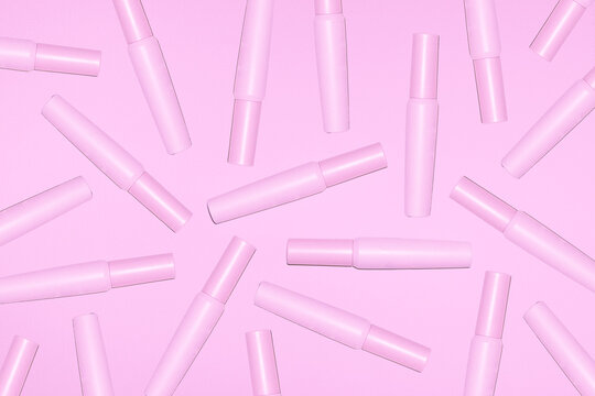 Pink mascara tubes create an elegant beauty pattern
