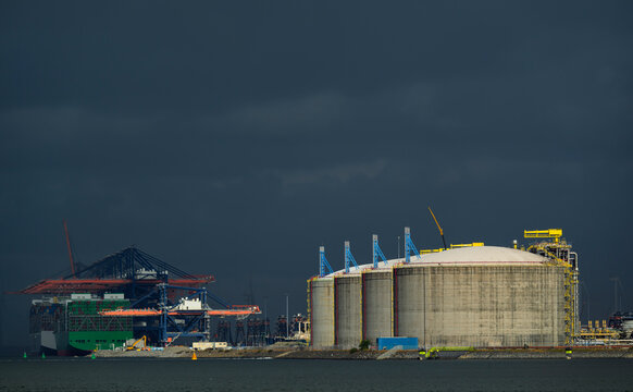 LNG storage and container terminal in Rotterdam harbour during storm