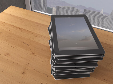 Table with stack of digital tablets, 3D Rendering
