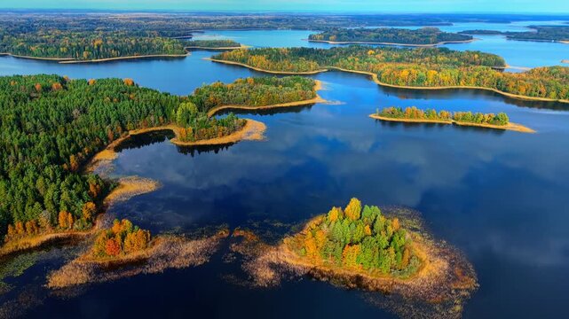 Aerial view of a vibrant autumn scenery showcasing island contours and lakes