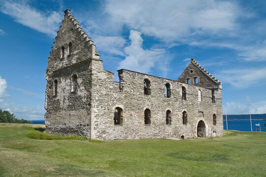 Historic Brahehus Castle Ruin with Stone Gables Under Blue Sky.