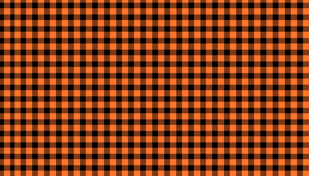 Orange and black buffalo plaid fabric texture pattern background for halloween and autumn