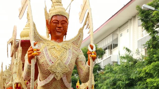 Beautifully carved wax float procession in Ubon Ratchathani Candle Festival, Thailand.