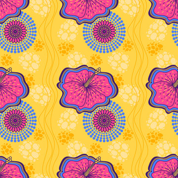 Vibrant hibiscus flowers and abstract circular elements creating a colorful seamless pattern