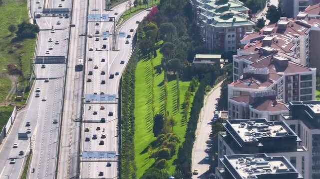 Highway view with landscaped areas and buildings in the city