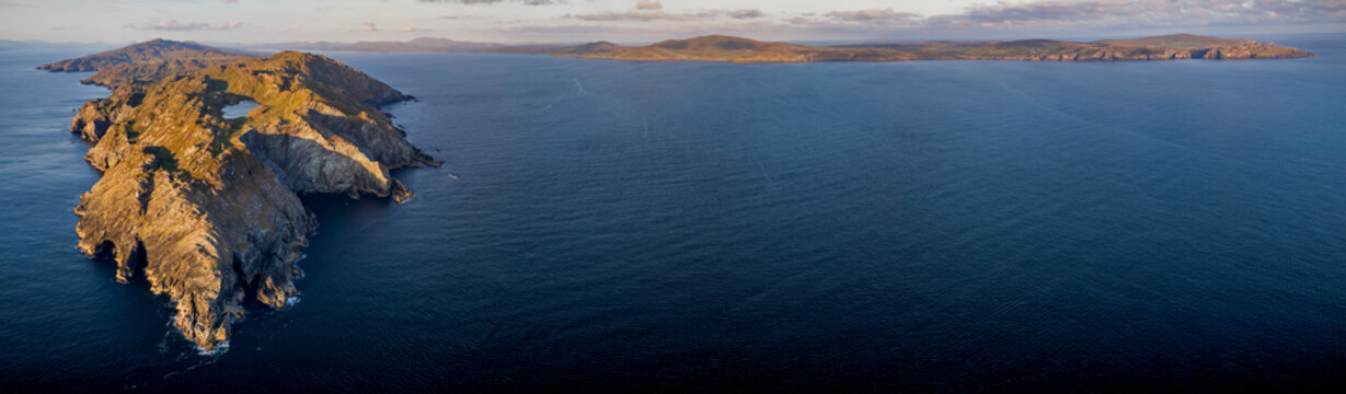 Aerial panorama of Sheep's Head peninsula in County Cork, Ireland. Wild Atlantic Way rugged coastline at sunset.