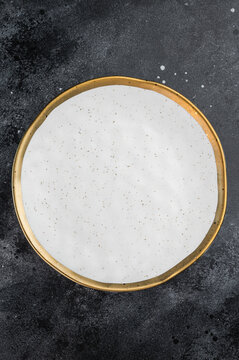 Luxury empty plate arranged in flat lay style on dark surface, stylish restaurant tableware mockup with copy space