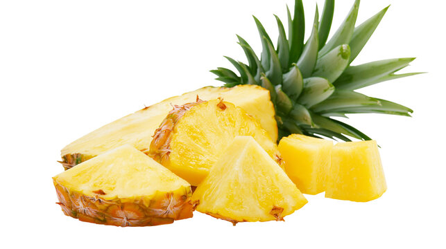 Fresh ripe pineapple slices and chunks with green spiky leaves