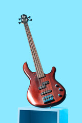 Fototapeta premium Music production and performance, electric bass guitar on a pedestal for recording studio sessions and live concert entertainment industry marketing