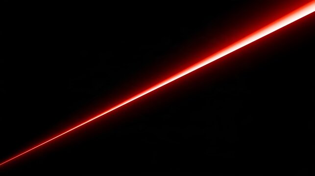 Bright glowing red laser beam cutting diagonally across deep dark black abstract futuristic background space illustration