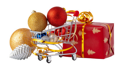 Fototapeta premium Shopping cart with Christmas ornaments and a wrapped gift during holiday season