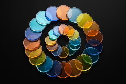 Spiral of Colorful Transparent Glass Circles on Black