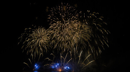 Fototapeta premium Colorful fireworks over cityscape at new year night