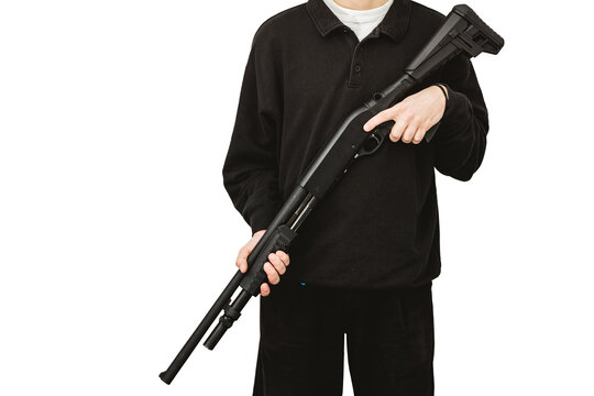 Man holding black tactical pump action shotgun 12 gauge over shoulder on white background