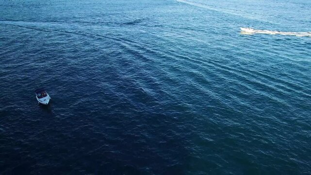 Boats on blue sea off the Campania coast Italy