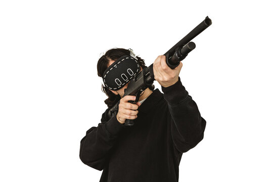 Man wearing virtual reality headset aiming shotgun controller in VR shooting simulation
