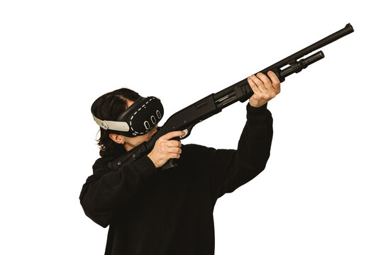 Man wearing virtual reality headset aiming shotgun controller in VR shooting simulation