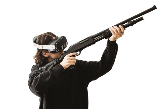 Man wearing virtual reality headset aiming shotgun controller in VR shooting simulation