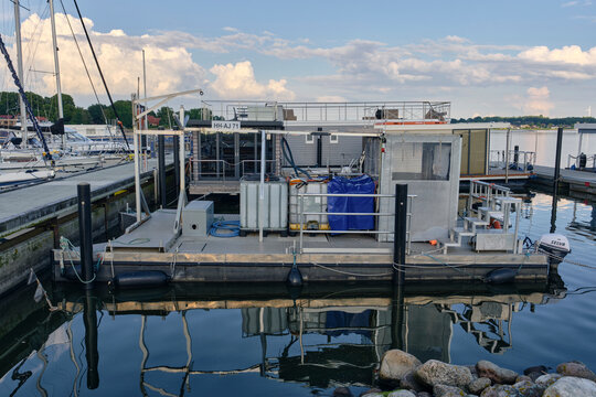 Schlei Fishing workboat catamaran in the marina, industrial maritime vessel for commercial aquaculture and water maintenance in Schleswig, Germany