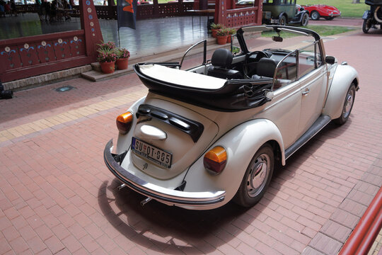 White classic 1970s Volkswagen Super Beetle 1303 cabriolet convertible vintage car high angle rear three quarter view showing open interior and folded top, Palic, Serbia, Jul 5, 2026