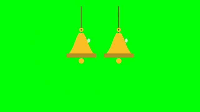 Two golden hanging bells isolated on a bright green background.