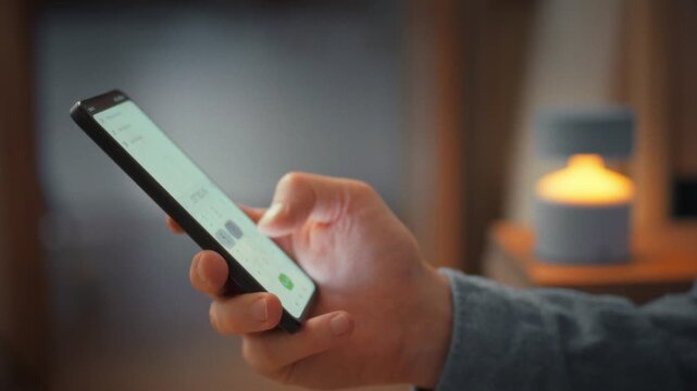 A man's hand glides across a smartphone keyboard, confidently dialing an unfamiliar number. The close-up captures this moment, underscoring mobile communication's role in everyday modern life