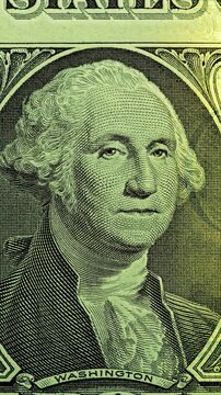 Moving green light sweeps across George Washington bill, causing banknote glow. Anti counterfeit effect exposes layered portrait details on U.S. currency with clear contrast.