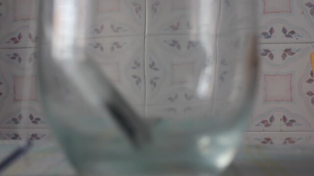 Tea Bag Steeping in a Glass of Hot Water