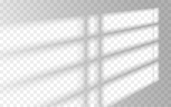 Sunlight casting shadows on transparent checked glass surface