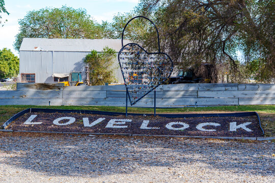 Lovelock Nevada Sign with the Love Locks locked onto heart shaped metal structure.
