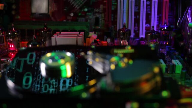 Futuristic server mainframe computing node inside computer hardware. Cinematic camera dolly left movement with tracking parallax angle focusing on background circuit board and vacuum tubes while