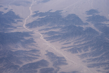 Fototapeta premium aerial view of arid canyon landscape in kash xinjiang