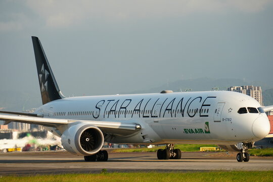 Passenger airplane in special livery taxiing on the runway.   