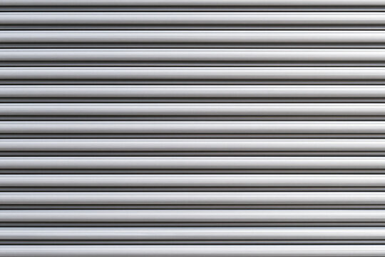 Grey horizontal corrugated metal rolling shutter texture