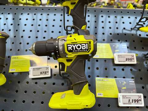 RYOBI brushless cordless drill displayed in hardware store.