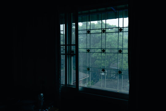 Heavy Rain View Through Black Silhouette Window Frame