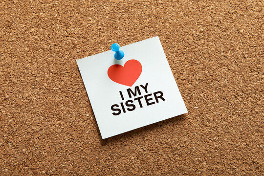 Sister love note pinned on cork board