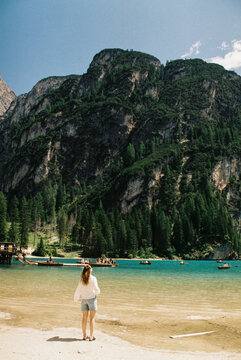 Woman Standing by Lago di Braies, Dolomites, Italy