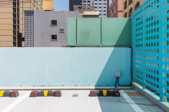Rubber Wheel Stops Parked in Outdoor Lot Near Buildings