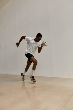 Runner practices in indoor space during training session